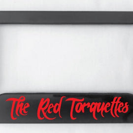 Available to TRT members, this black number plate surround is made from ABS plastic in red writing.