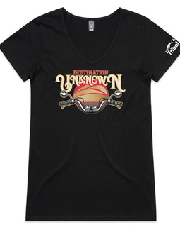 This design is of motorbike handlebars in front of a sunset with the words destination unknown on a black womens v neck tee