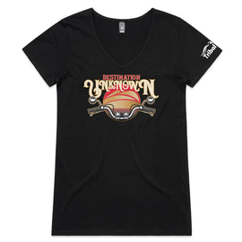 This design is of motorbike handlebars in front of a sunset with the words destination unknown on a black womens v neck tee