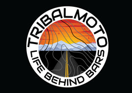 Design of a sunset with road and mountains, layered with topography lines and surrounded by the words TribalMoto Life behind bars on a decal