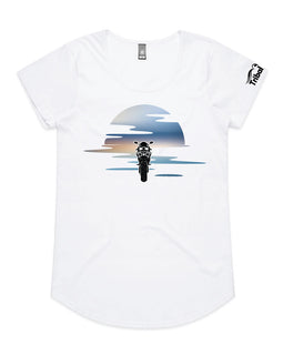 This design is of a motorbike in front of a beautiful sunset on ladies white tee