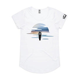 This design is of a motorbike in front of a beautiful sunset on ladies white tee