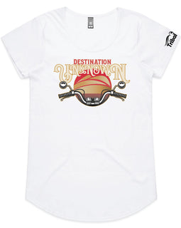 This design is of motorbike handlebars in front of a sunset with the words destination unknown on a womens white tee