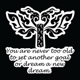 Black tribal image of heart, wings and motorcycle tyre with the words You are never too old to set another goal or dream a a new dream.