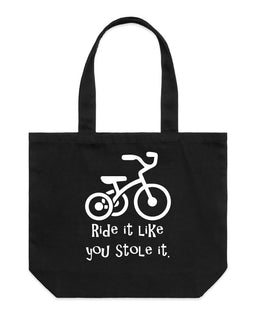 Ride it like you stole it - what ever it is! This great design is of a trike, with the words Ride it like you stole it underneath on a wide tote bag