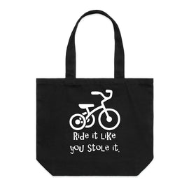 Ride it like you stole it - what ever it is! This great design is of a trike, with the words Ride it like you stole it underneath on a wide tote bag