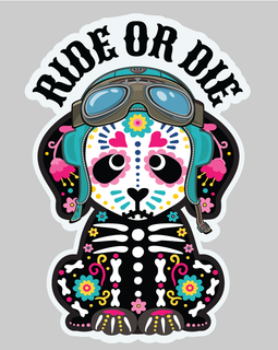 A die-cut sticker featuring a cartoon dog styled with Day of the Dead sugar skull makeup, wearing aviator goggles and a skeleton-print jacket, beneath the text 'RIDE OR DIE' in black arched letters, shown on a solid gray background.