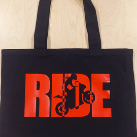 Black tote with design of the word ride with a female rider within the words