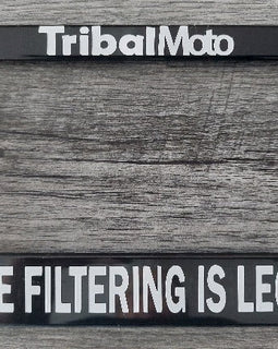 Motorcycle number plate frame with words TribalMoto at top and Lane filtering is legal at bottom in white.