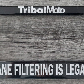 Motorcycle number plate frame with words TribalMoto at top and Lane filtering is legal at bottom in white.